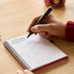 writing down New Years resolutions for 2026