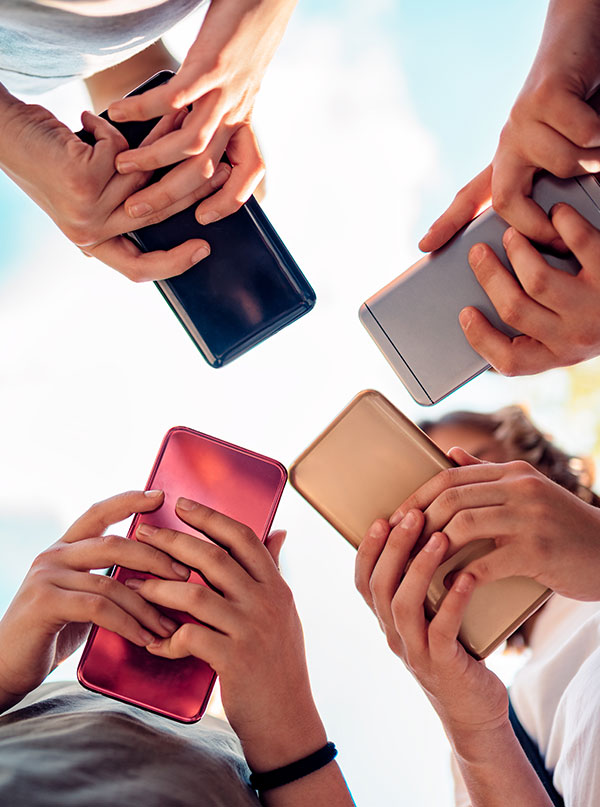 teens all staring at phones