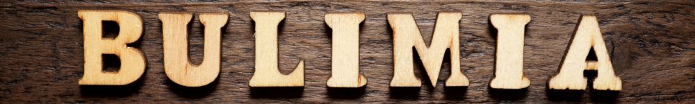 Bulimia spelled out in wooden lettering