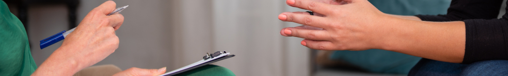 A pair of hands in a therapy office depicting cognitive behavioral therapy