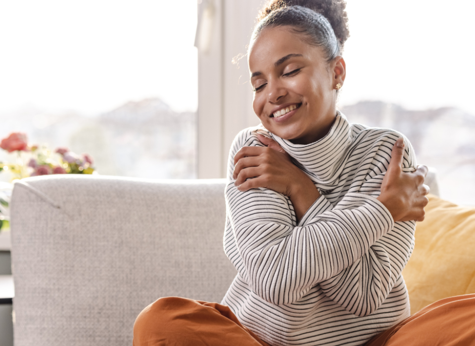 woman hugging herself in a showing of self-love