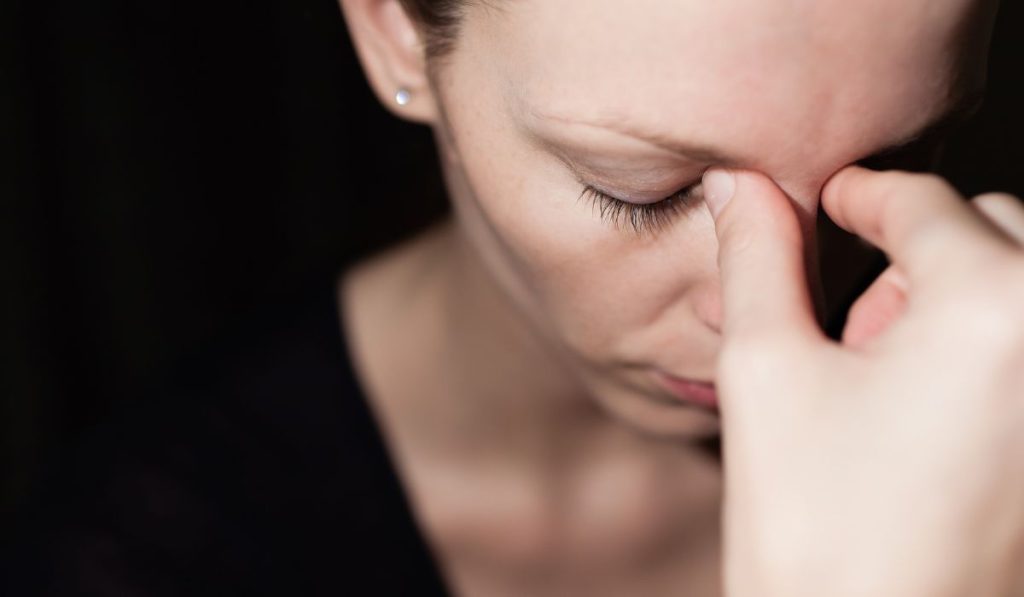 woman being impacted by the affects of stress