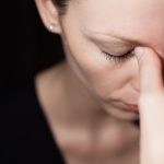 woman being impacted by the affects of stress