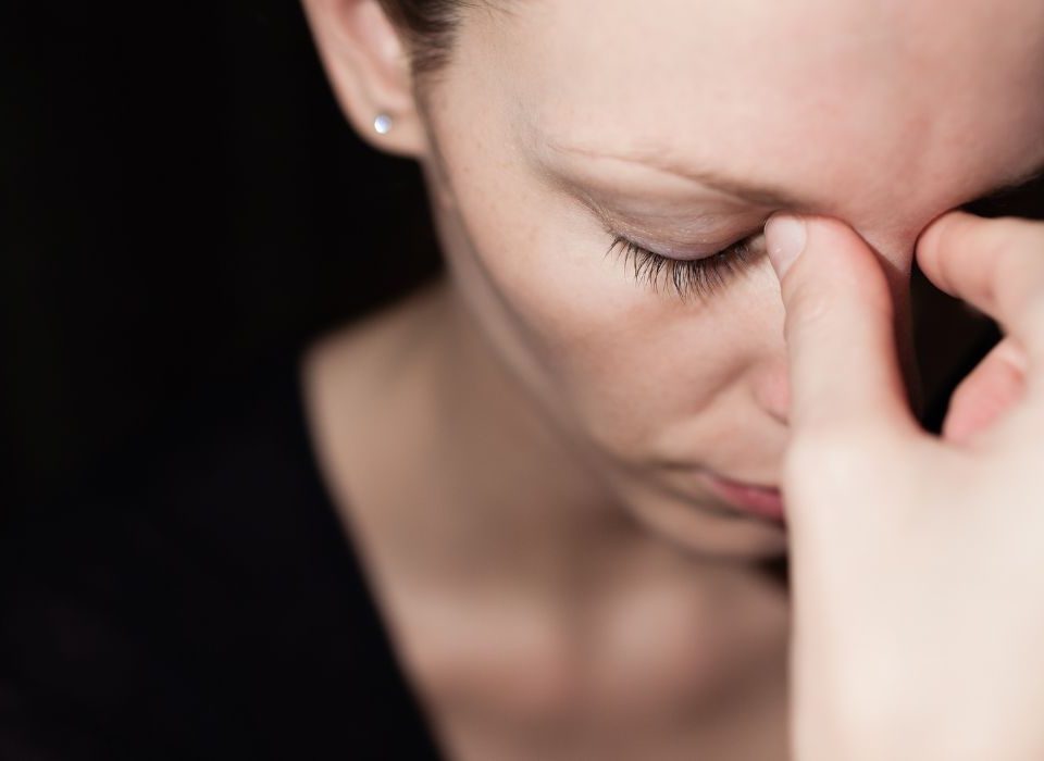 woman being impacted by the affects of stress