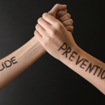 Two arms depicting suicide prevention
