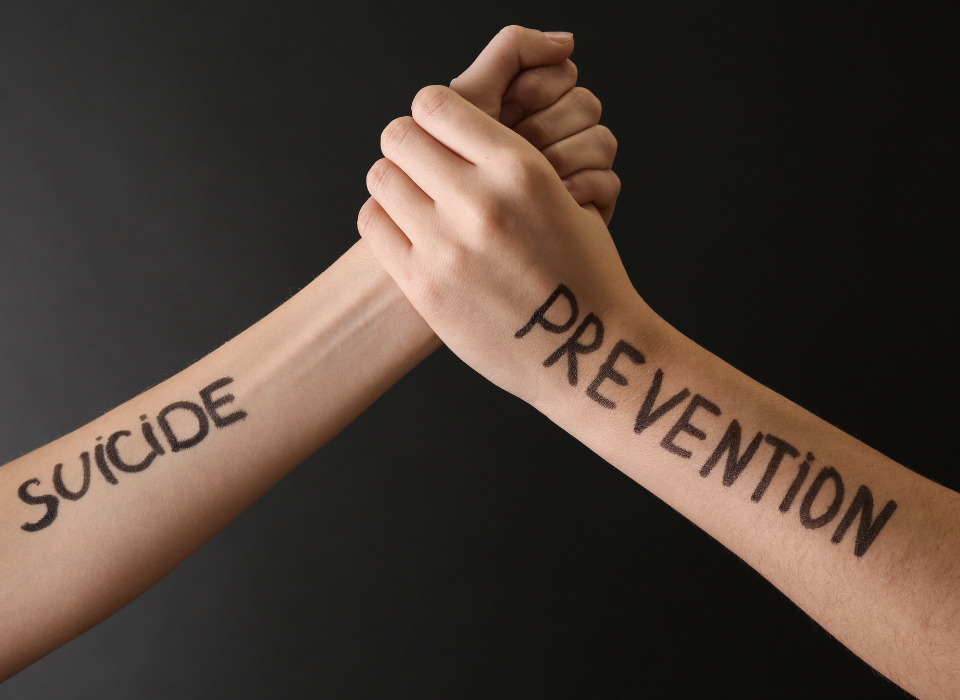 Two arms depicting suicide prevention