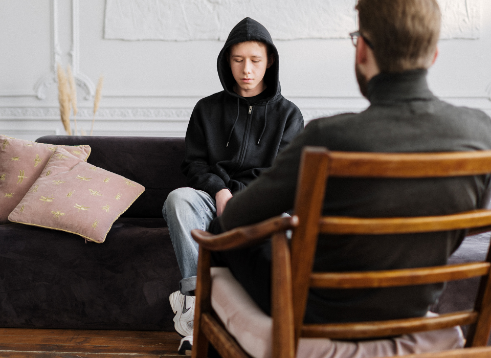 Therapist performing acceptance and commitment therapy on a client
