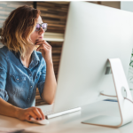 Woman searching the internet on her computer looking for a therapist