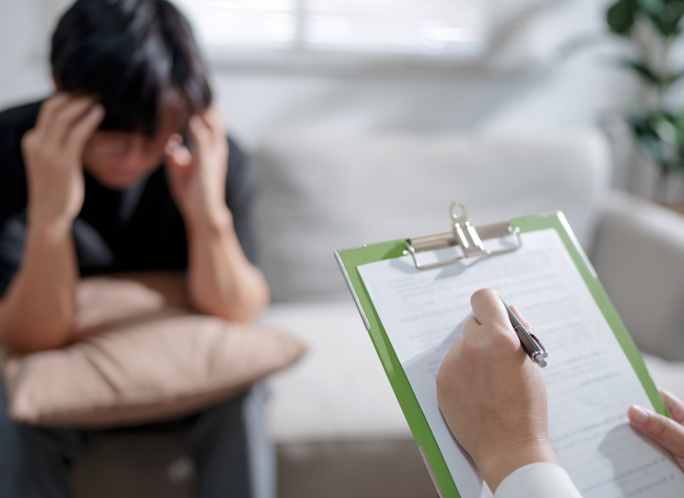 young man meets with a therapist to see if his PTSD is a mood disorder