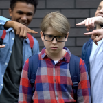 Young teen boy dealing with the social pressures in school