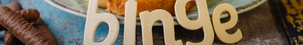 wooden letters spelling out binge to depict binge eating disorder