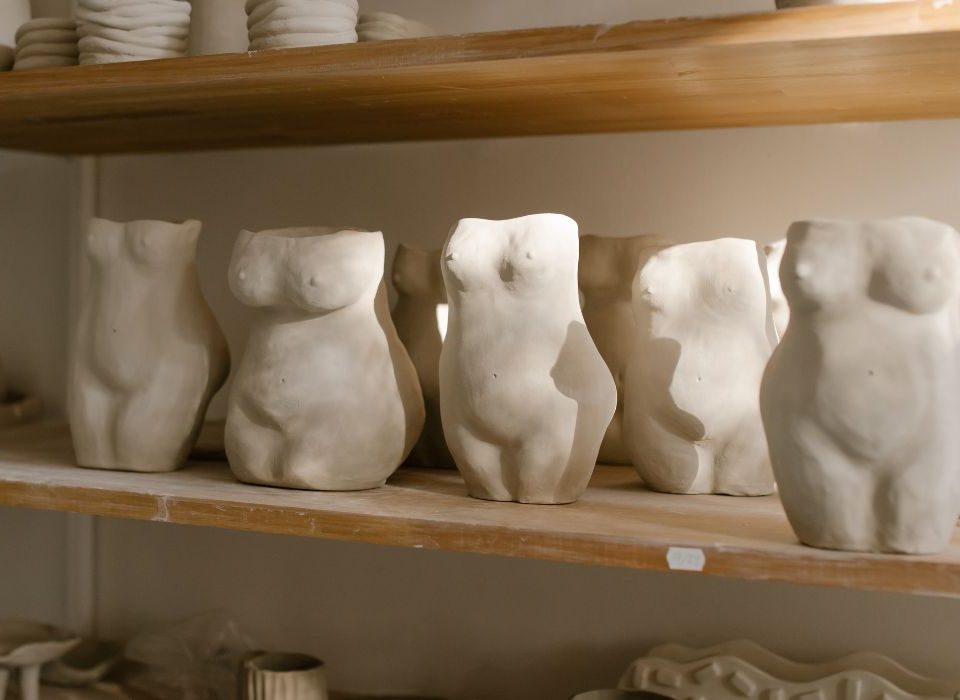 body image depicted in clay sculptures
