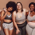 Woman of various sizes celebrating their bodies together