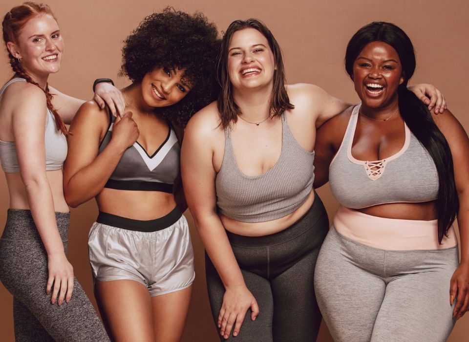 Woman of various sizes celebrating their bodies together