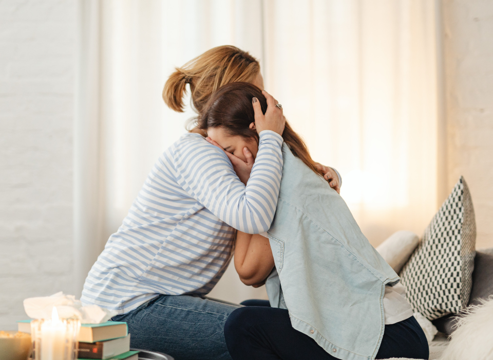 Mother comforting her daughter suffering from bulimia