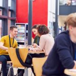 College students sitting in a dining hall