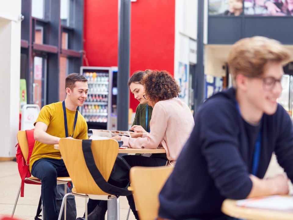 College students sitting in a dining hall