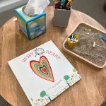 therapy book with a mini sand box