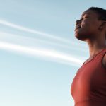 African American woman practicing deep breaths to help with her social anxiety