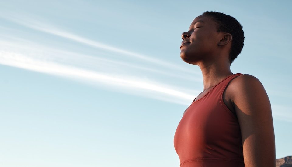 African American woman practicing deep breaths to help with her social anxiety