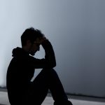 silhouette of a teenage boy suffering from depression