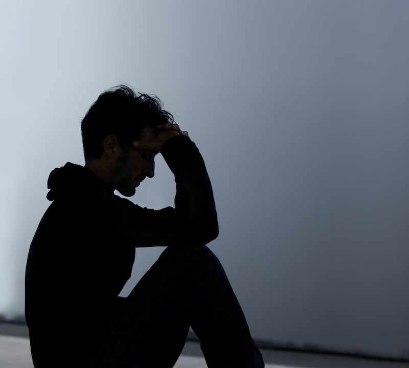 silhouette of a teenage boy suffering from depression