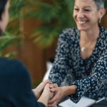 Therapist sitting down with a client during an individual counseling session