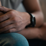 Man arms crossed dealing with mental health disorders