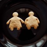 Two cookies a boy and a girl depicting childhood obesity