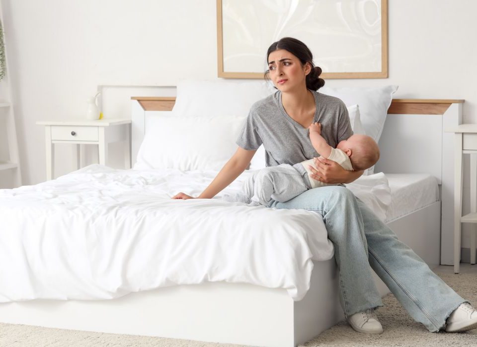 Mother suffering from either postpartum depression or the baby bllues