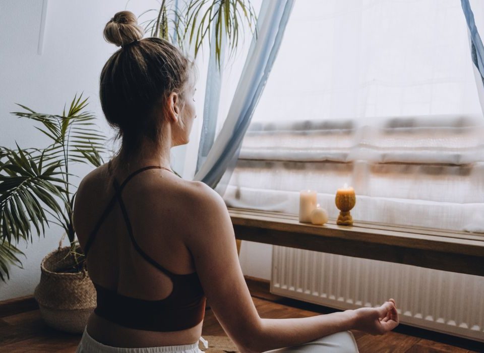 woman practicing yoga as part of her eating disorder recovery